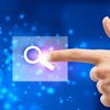 finger pressing search icon
