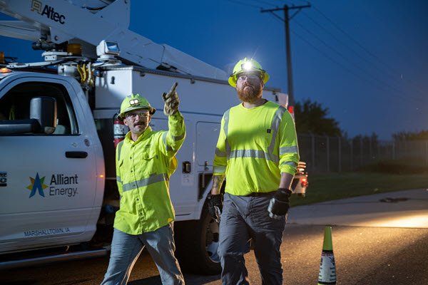 employees near a truck at night