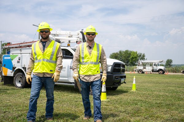 employees in front of a truck