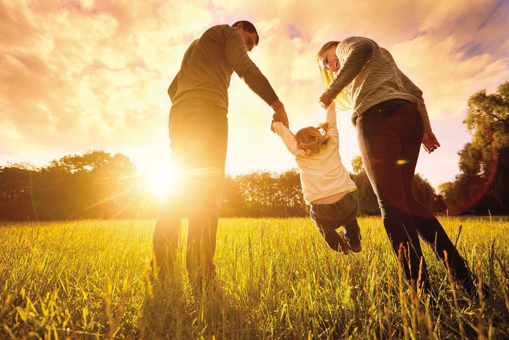 Family in a sunny field