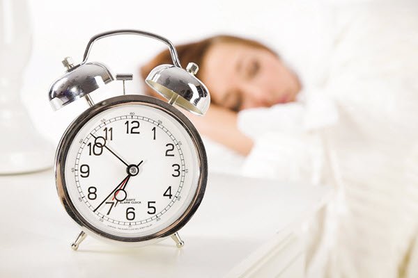 alarm clock and person sleeping