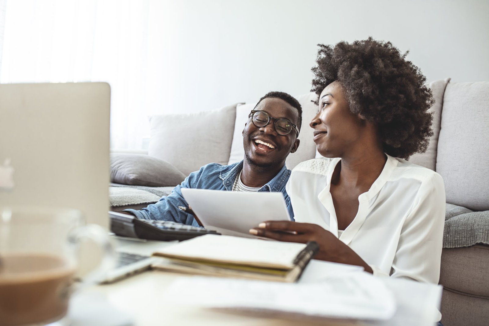 couple talking as they pay bills