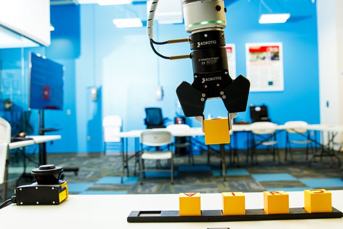 A robot in a laboratory picking up an item