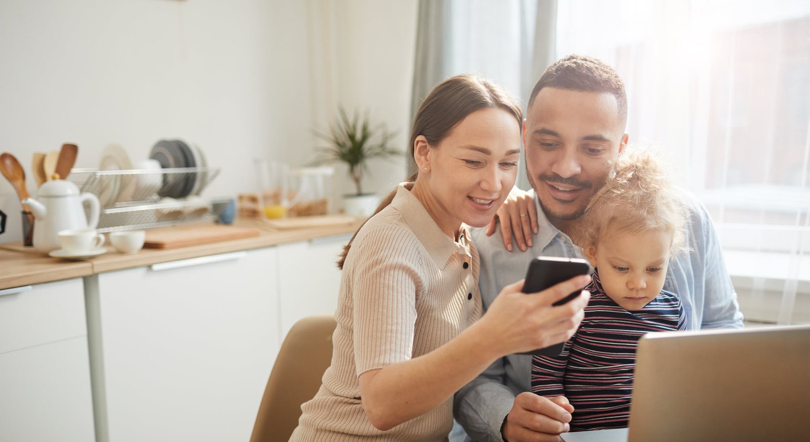 family sitting at a computer