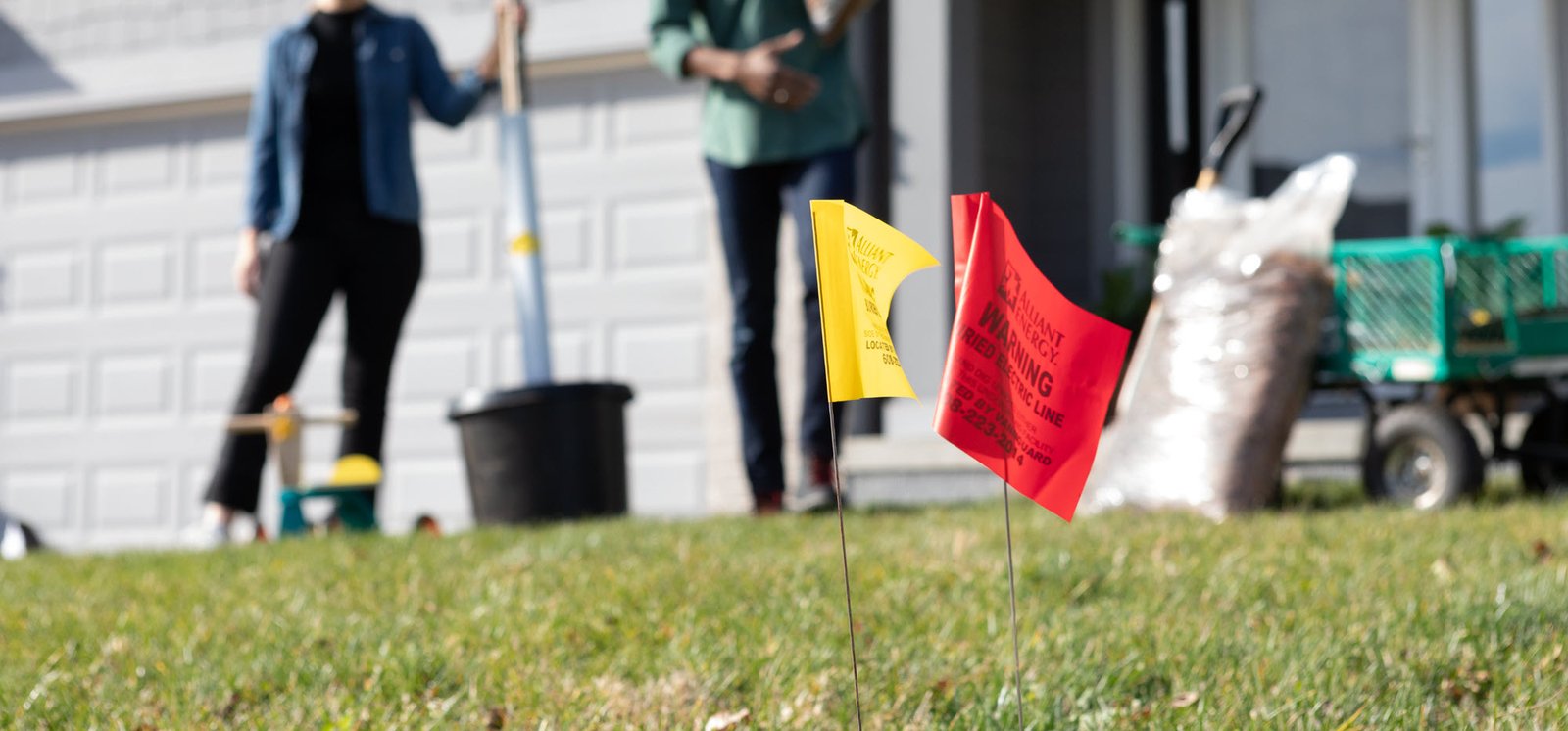 Call 811 flags in the grass