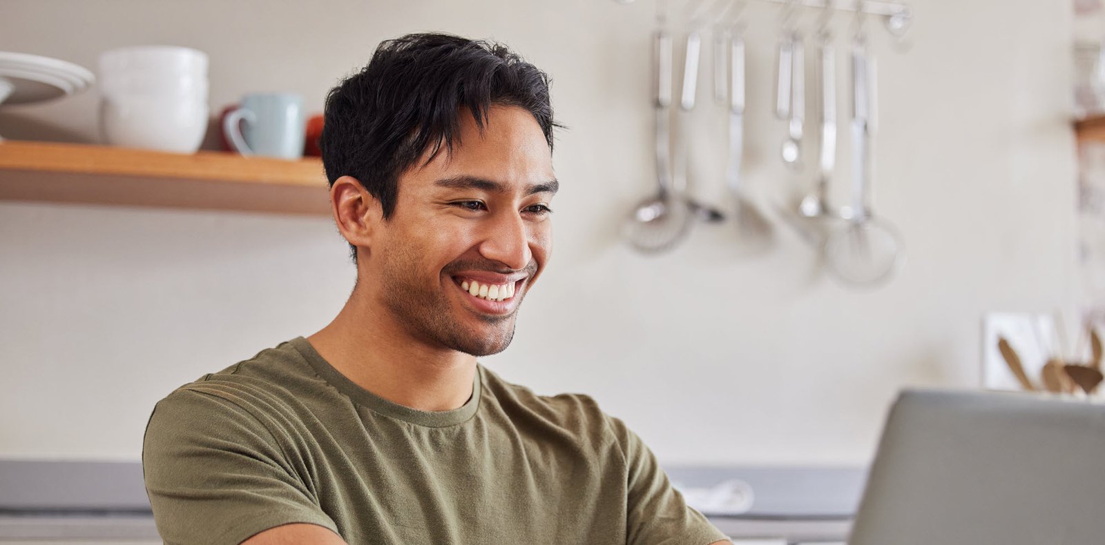 smiling man on a laptop